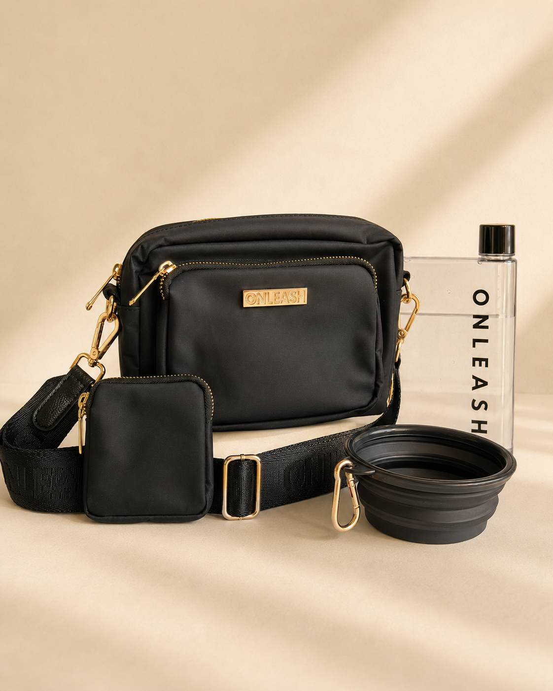 The Elliot Bundle with black Elliot Bag, detachable Treat Pouch, Water Bottle and collapsible Travel Bowl