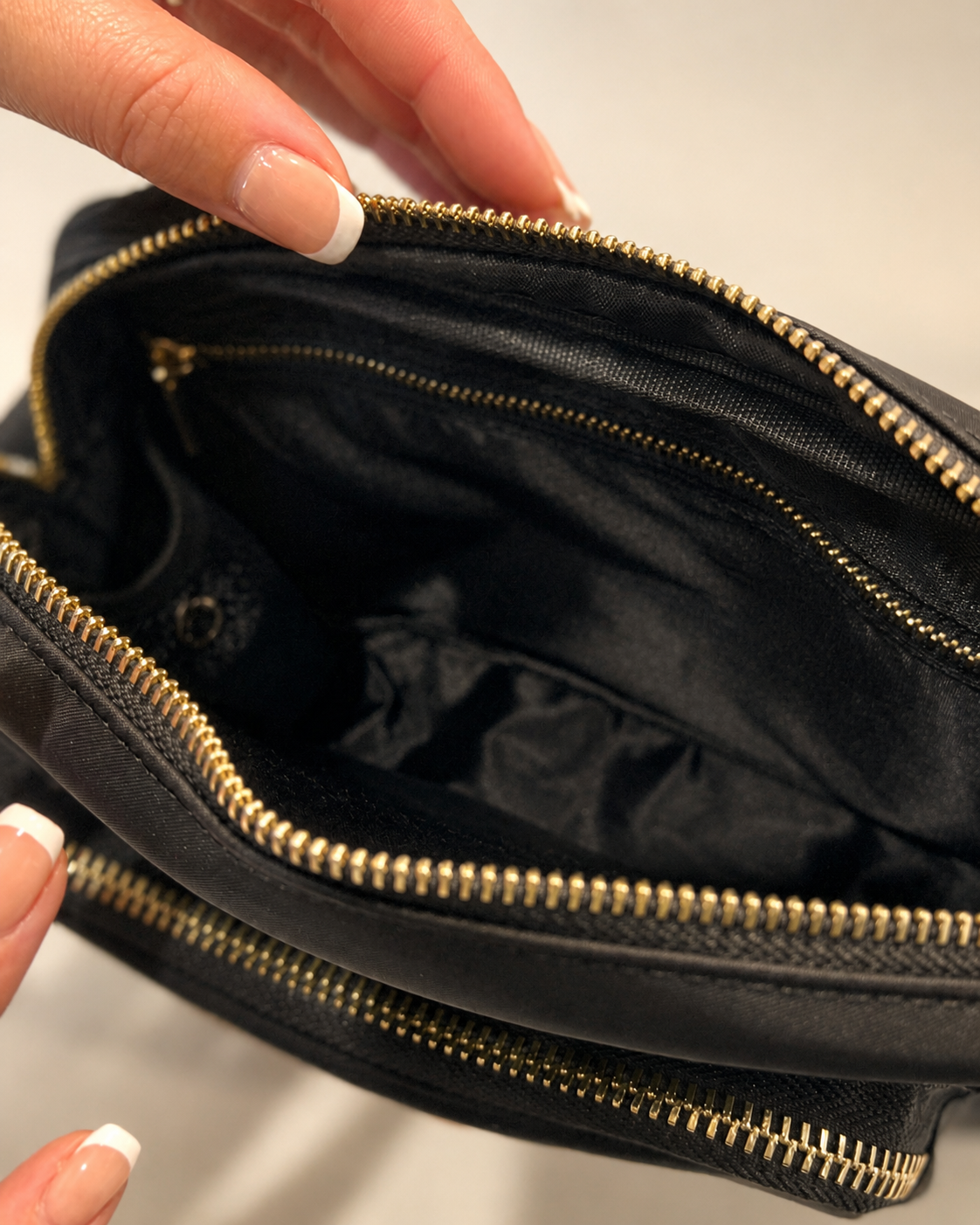 Interior divider and zipped pocket inside The Elliot Bag
